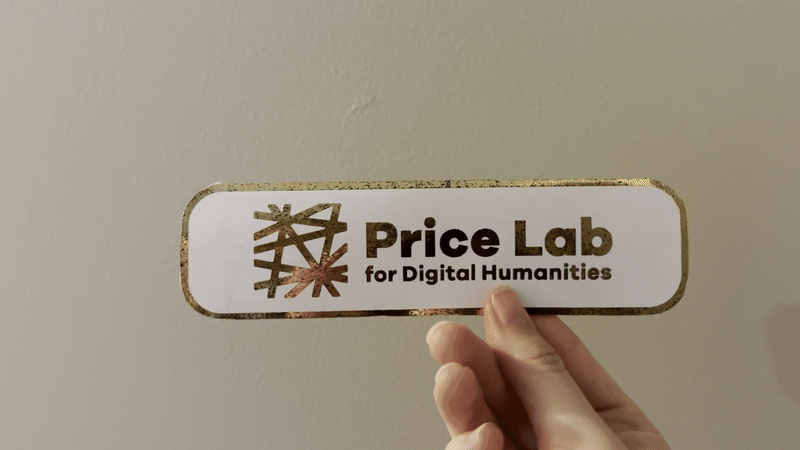 animated GIF of white bookmark with gold text that reads my digital humanities is and then when the switch is pressed it reveals the word lit