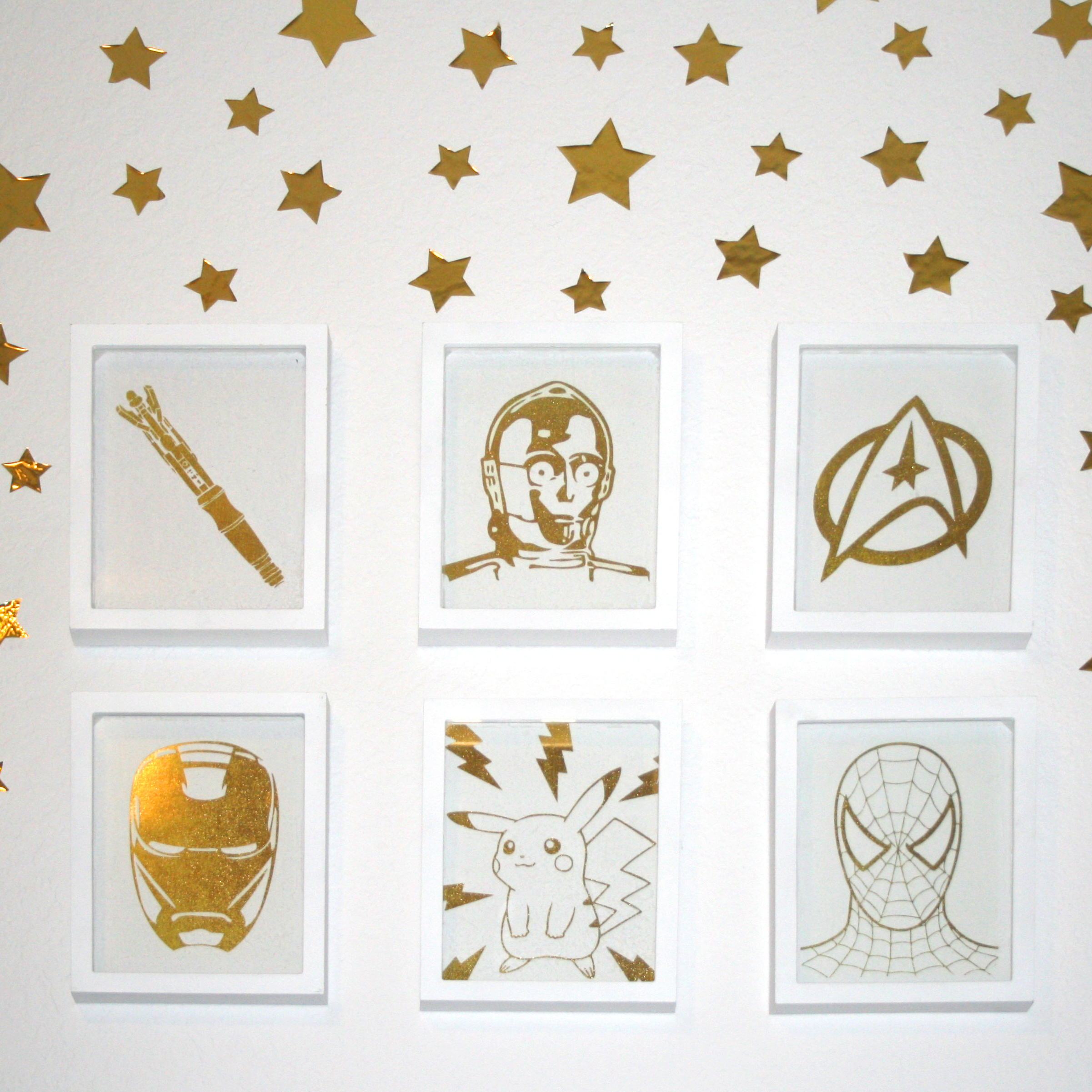 6 white frames surrounded by gold star stickers, sonic screwdriver, C3PO, Star Trek, Iron Man, Pikachu, Spider-Man